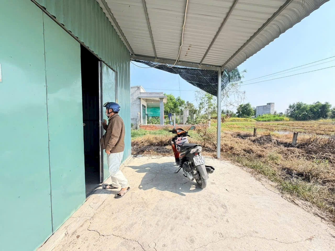 Bán đất lúa đường xe máy tặng nhà mái tôn lưới rào bao quanh dt 1000m2 xã Nhựt Chánh giá 1 tỷ 3